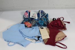 An as new Casa Raki light blue triangle bikini (Size top S, bottoms M), an as new Johanna Ortiz dark