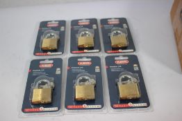 Six as new Abus Premium 65/40 security level 5 brass padlocks.