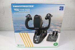 A Thrustmaster TCA Yoke Pack Boeing Edition controller (Designed for X-Box).