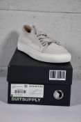 A pair of boxed as new SuitSupply Suede - Uni sneaker in off white (Size UK 8 EU 42).