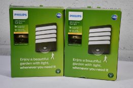 Two boxed as new Phillips LED Outdoor Wall Lights - Warm White Light - Raccoon/Anthracite/Sensor.