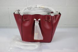 An as new Michael Kors Phoebe Large Faux Leather Bucket Bag in Mulberry.