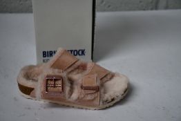 A pair of children's Arizona Shearling fur lined light Rose Birkenstocks (Size UK 11.5 (28)).