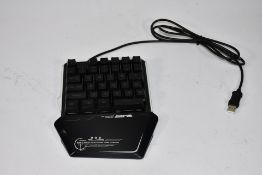 Ten black Lexon Tech one handed gaming keyboards with rainbow back lights.