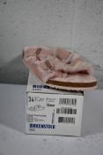 A pair of children's Arizona Shearling fur lined light Rose Birkenstocks (Size UK 2 (34)).