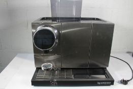 A pre-owned Nespresso Momento 120 Coffee and Milk Machine (Viewing recommended).