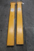 A pair of 5ft forklift fork extensions.