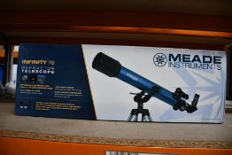 A boxed as new Meade Infinity 70 telescope.
