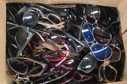 Approximately ninety pairs of pre-owned sunglasses and related (Largely unbranded).