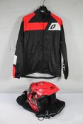 An adults Comas Trials Bike Helmet in red, size medium and an Adults Jitsie Trials Bike Jacket, size