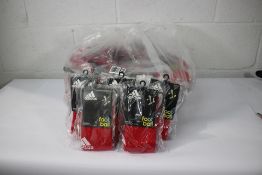 Forty nine pairs of children's as new Adidas red football socks (EU 31-33).