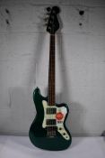 A Fender Squier Paranormal Rascal electric bass guitar in Sherwood green (Tiny dent on back of neck)