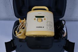 A pre-owned Medela Symphony Double Electric Breast Pump in Carry Case, item is untested.