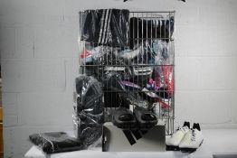 A basket of approximately thirty five items of assorted sports wear to include mainly Adidas - footb