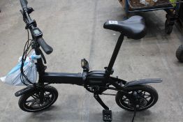 A Whirlwind folding electric bike with charger.