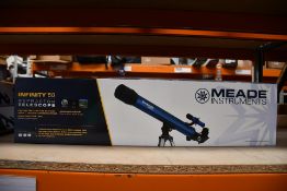A boxed as new Meade Infinity 50 reflector telescope.