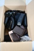 A small box of sunglasses/purses/wallets and watches.