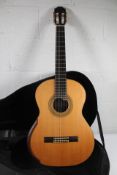 A Steven Reiner hand crafted acoustic guitar with a hard case.