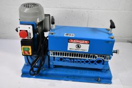 A pre-owned wire stripper (Requires a two pin plug adaptor).