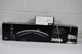 A boxed Thule K - Guard lockable and tiltable Kayak car carrier and a Thule fitting Kit 18 6030.
