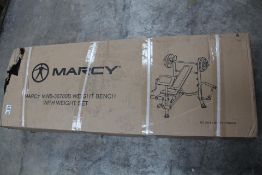 A Marcy MWB-36780B Weight Bench with Weight Set.