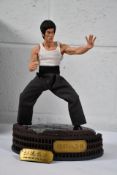 A boxed CHINA. X - H 1/6 Bruce Lee's 78th Anniversary Way Of The Dragon Figure.