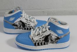 A pair of Nike Air 1 Mid Game Winner GS in university blue starfish (UK 5Y) (Unboxed).