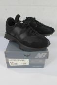 A pair of as new New Balance 327 Black Synthetic Suede Trainers (UK 6).