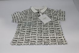 An as new Dior logo baby Blanc/Noir 6M polo top.