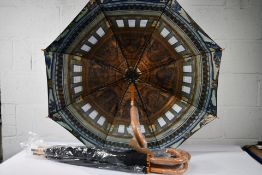 Five black walking automatic opening umbrellas with wooden crook handle and lined with a picture of