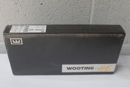 A boxed as new Wooting 60HE wired mechanical gaming keyboard (Arm, ISO - no keycaps, Lekker Linear.