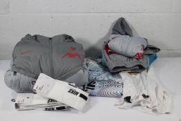 Eight items of as new Nike Clothing to include a Nike x Liverpool Dri-Fit Jacket in size M, two Pack