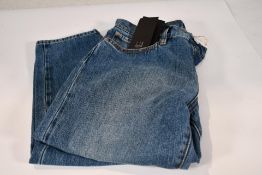 A pair of Alfred Dunhill light wash straight leg jeans (Size 30L).