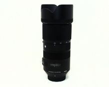 A pre-owned Sigma 100-400mm f/5-6.3 DG OS Contemporary Lens for Nikon (Grade B).