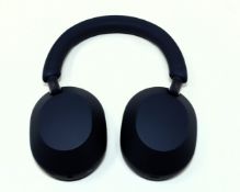 A pre-owned pair of Sony WH-1000XM5 Wireless Noise Cancelling Over-Ear Headphones in Midnight Blue w