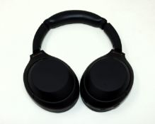 A pre-owned pair of Sony WH-1000XM4 Wireless Noise Cancelling Over-Ear Headphones in Black (Grade B/