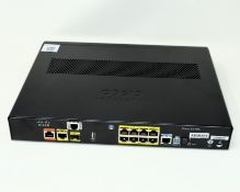 A pre-owned Cisco C897VA-K9 Integrated Services Router.