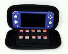 A pre-owned Nintendo Switch Lite (HDH-001) Hand-Held Game Console in Purple with ten assorted game c