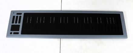 A pre-owned Roli Seaboard RISE 2 MIDI Keyboard Controller (Sold for parts only - does not power on.