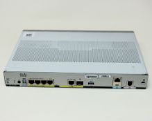 A pre-owned Cisco C1117-4P Integrated Services Router.