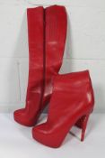 A pair of women's pre-owned Christian Leboutin Red Leather Platform Knee Boots (EU 39.5).