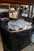 A pallet of pre-owned clothing and related items.