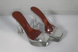 A pair of women's pre-owned Amina Muaddi Glass Plateau Slippers - Transparent (EU 39).