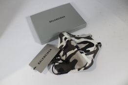 Fifty boxed as new Balenciaga face masks.