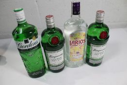 Two bottles of Tanquerary London Dry Gin (2 x 1ltr), a Gordons London Dry Gin (1ltr) and a Larious M