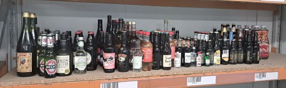 A quantity of bottles of beers, lagers, ciders, IPAs and soft drinks close to or past Best Before D