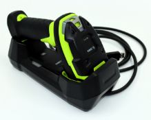 A pre-owned Zebra DS3678-SR Rugged Bluetooth Barcode Scanner with Battery and USB Cradle (P/N: DS367