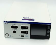A pre-owned Olympus ESG-400 Electrosurgical HF Generator (Box states 'Faulty loan unit - ESG-148 err