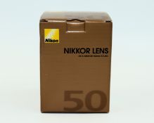 A boxed as new Nikon AF-S 50mm f/1.8G NIKKOR Lens (EAN: 018208021994).