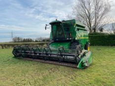 1999 John Deere 2264 combine harvester with John Deere 820 20ft header on Dneproshina 30.5LR32 front